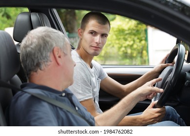 father teaching his son to drive - Powered by Shutterstock