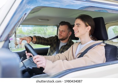 Father Teaching His Teenage Son To Drive