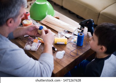 Father Teaching Preschooler Child Do Craft Items. DIY Concept, Science Lesson At Home