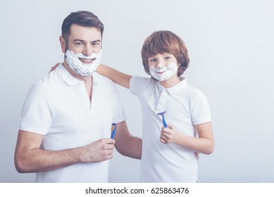 Father Teaching Son How To Shave