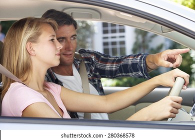 Father Teaching Teenage Daughter To Drive