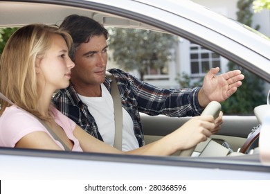 Father Teaching Teenage Daughter To Drive