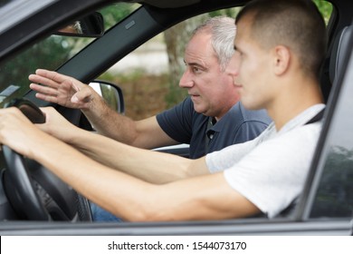 Father Teaching Teenage Son To Drive