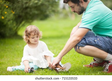 father tell his cute toddler daughter about dinosaurs. family leisure outdoors. boys toys for girl. concept of father and daughter relationship and friendship. - Powered by Shutterstock