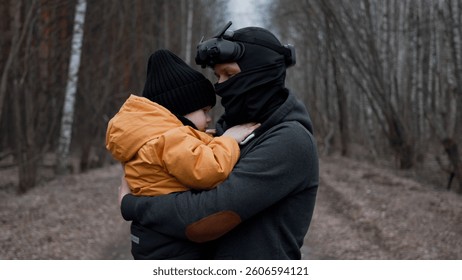 Father Using VR Headset While Holding Son in Arms in Enchanted Forest - Virtual 