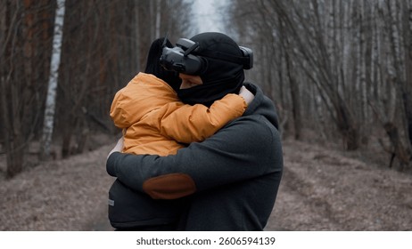 Father Using VR Headset While Holding Son in Arms in Enchanted Forest - Virtual  - Powered by Shutterstock - Get 15% off with code: PIKWIZARD15