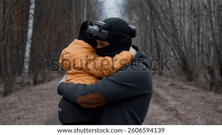 Father Using VR Headset While Holding Son in Arms in Enchanted Forest - Virtual 