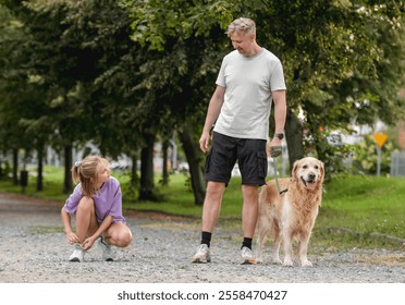 Father Watching As A Girl Ties Shoelaces With A Golden Retriever Dog Nearby - Powered by Shutterstock