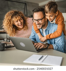 father work from home whit his wife and son - Powered by Shutterstock