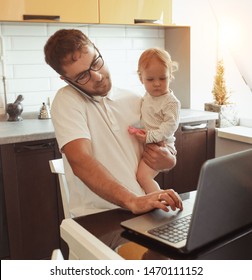 Father Working From Home On Laptop With Baby daughter - Shutterstock ID 1470111152