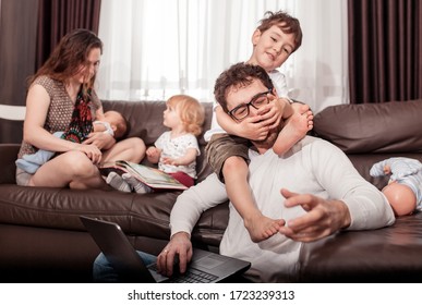 Father works at home. Full family stay home. Father freelancer try to work at home with children. quarantine - Shutterstock ID 1723239313