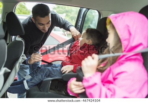 Father\
worried about her children\'s safety in a\
car