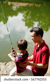 Father And Young Son, Fishing