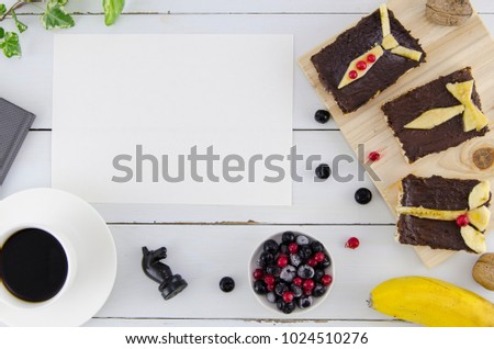Father's day background with blank paper, sweet breakfast from tosts, berry and coffee. Closeup with white wooden background and empty copy space for your text. Flat lay mockup