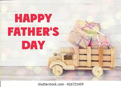 Fathers day background with toy truck with gift boxes in the back. Fathers Day message. Happy fathers day concept.  - Powered by Shutterstock