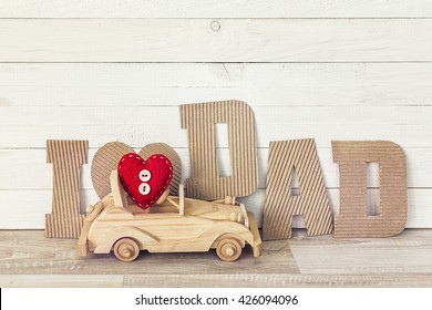 Fathers Day Background With Wooden Toy Car And Cardboard Letters. I Love Dad. Happy Fathers Day Concept.