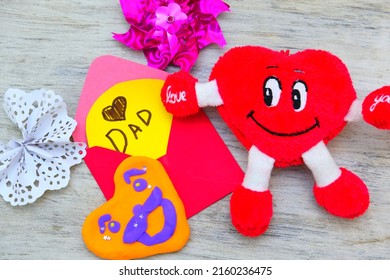 Fathers Day, Birthday Or Valentines Day . Child Making Funny Crafts, Greeting Card From Paper And Clay, Plasticine.  Arts  Crafts Concept.