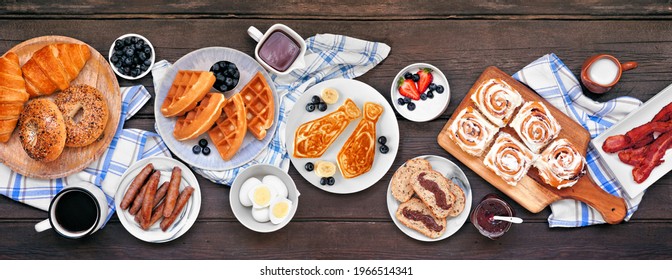 Fathers Day Brunch Table Scene. Top View On A Dark Wood Banner Background. Tie Pancakes, Mustache Toast And An Assortment Of Dad Themed Food.