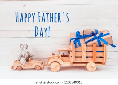 Father's Day Card. Wooden Car With Toy Bear And Wooden Truck With Gifts. Happy Father's Day.