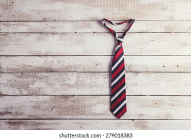 Fathers day composition of colorful tie hang on wooden wall backround. - Powered by Shutterstock