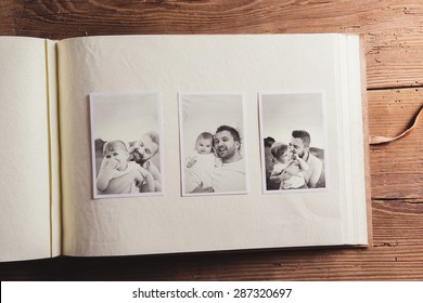 Fathers day composition - photo album with a black and white photos. Studio shot on wooden background. - Shutterstock ID 287320697