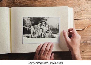 Fathers day composition - photo album with a black and white photo. Studio shot on wooden background. - Shutterstock ID 287321060