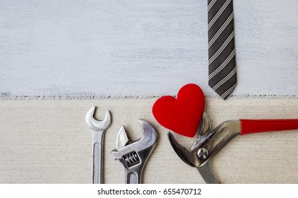 Father's day concept background, tool and red heart on canvas fabric - Powered by Shutterstock