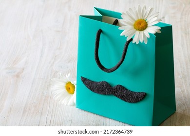 Fathers Day Concept With Flower In Gift Bag On Light Background