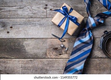 Father's Day Concept - Present, Tie On Rustic Wood Background