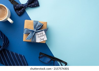 Father's Day concept. Top view photo of craft paper giftbox with ribbon bow and postcard cup of coffee glasses blue necktie and bow-tie on bicolor blue background with copyspace