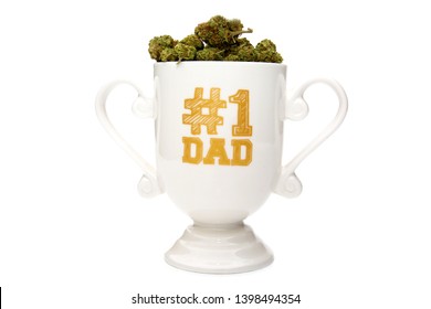 Fathers Day Gift. Fathers Day Mug Reads #1 Dad. Gift Mug Filled With Marijuana. Isolated On White. Room For Text. 