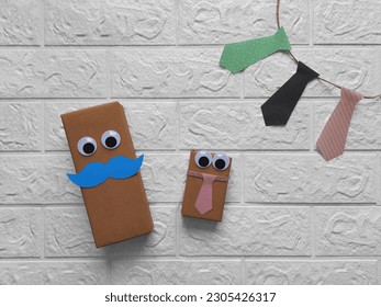 Father's Day Gifts. Copy space. DIY gift wrapping. Gift boxes with eyes, mustaches, ties. Flat design. Gift wrapping idea for Father's Day, Grandfather's Day, birthday, bachelor party. - Powered by Shutterstock