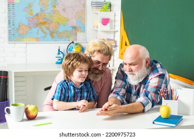 Fathers Day. Grandfather Father And Son Learning At School, Playing Games.