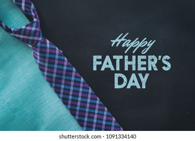 Father's Day Graphic For Celebration Of Holiday.  Includes Plaid Tie On Black Background With Text.