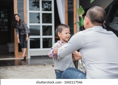 Father's Day. Happy Family Son Running And Hugging Dad After Work