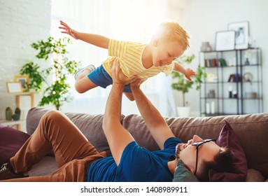 Father's day. Happy family son hugs his dad  on holiday - Shutterstock ID 1408989911