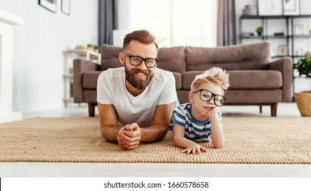 Father's Day. Happy Funny Family Son  And Dad With Glasses On Holiday