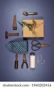 Father's Day Or Masculine Birthday Theme Flatlay Background Styled With Gift, Chocolate Tool Set And Tie. Blog Hero Header Creative Composition. Vertical Styling.