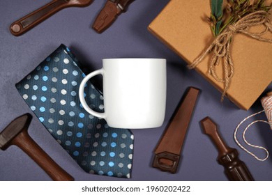 Father's Day Or Masculine Birthday Theme White Coffee Cup Flatlay Styled With Gift, Chocolate Tool Set And Tie. White Product Mock Up With Negative Copy Space For Your Text Or Design Here.