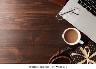 Father's day morning concept. Top view composition of gift, tie, and coffee on dark wood background - Powered by Shutterstock