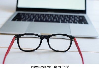 Fatigue From Work, A Notebook In Front Of Which The Glasses Remove Fatigue
