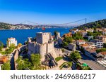 Fatih Sultan Mehmet Bridge and Anadolu Hisari (Anatolian Fortress) in Istanbul, Turkey. Beautiful Istanbul bosphorus landscape. Drone shot.