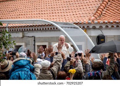 FATIMA, PORTUGAL - May 13, 2017: Pope Francis Greeting Pilgrims In Fatima Inside His Papamobil Outside With Group Of People Taking Pictures With Their Mobile Phone