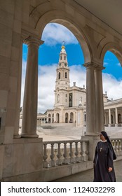 Fatima, Portugal / Monday, ‎September ‎4, ‎2017 Nun Walking In Shadow Crossing Fatima Sanctuary