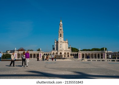 Fatima, Portugal - November 13 2022 - People Passing The Square In Front Of The Basilica Of Our Lady Of The Rosary Of Fatima