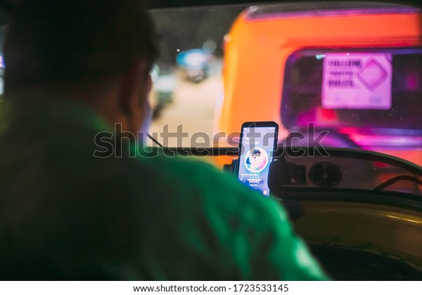 Fatona, Goa, India - February 13, 2020: Driver Of\
Auto Rickshaw Or Tuk-tuk At\
Work