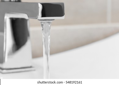 Faucet In Bathroom, Water Is Running