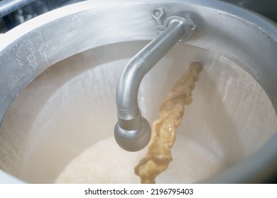 The Faucet Of The Production Vat At The Brewery In The Process Of Brewing Beer. Background With Selective Focus And Copy Space For Text