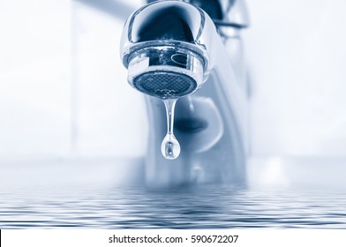 Faucet and water drop close up - Shutterstock ID 590672207
