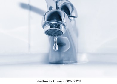 Faucet With Water Drop Close Up